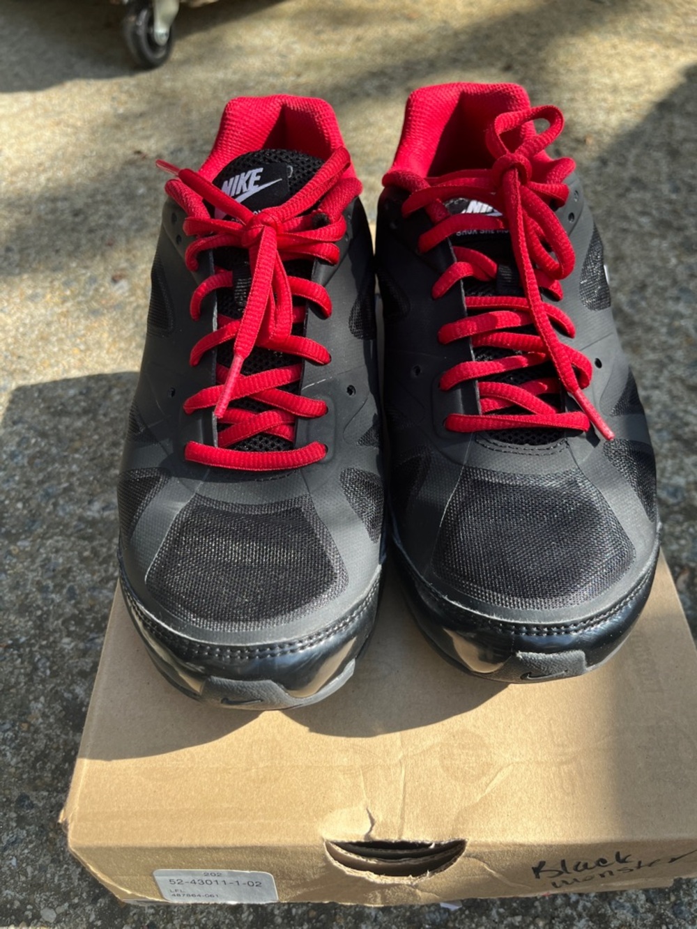 Nike Women’s Black Athletic Shoes with Red Accents